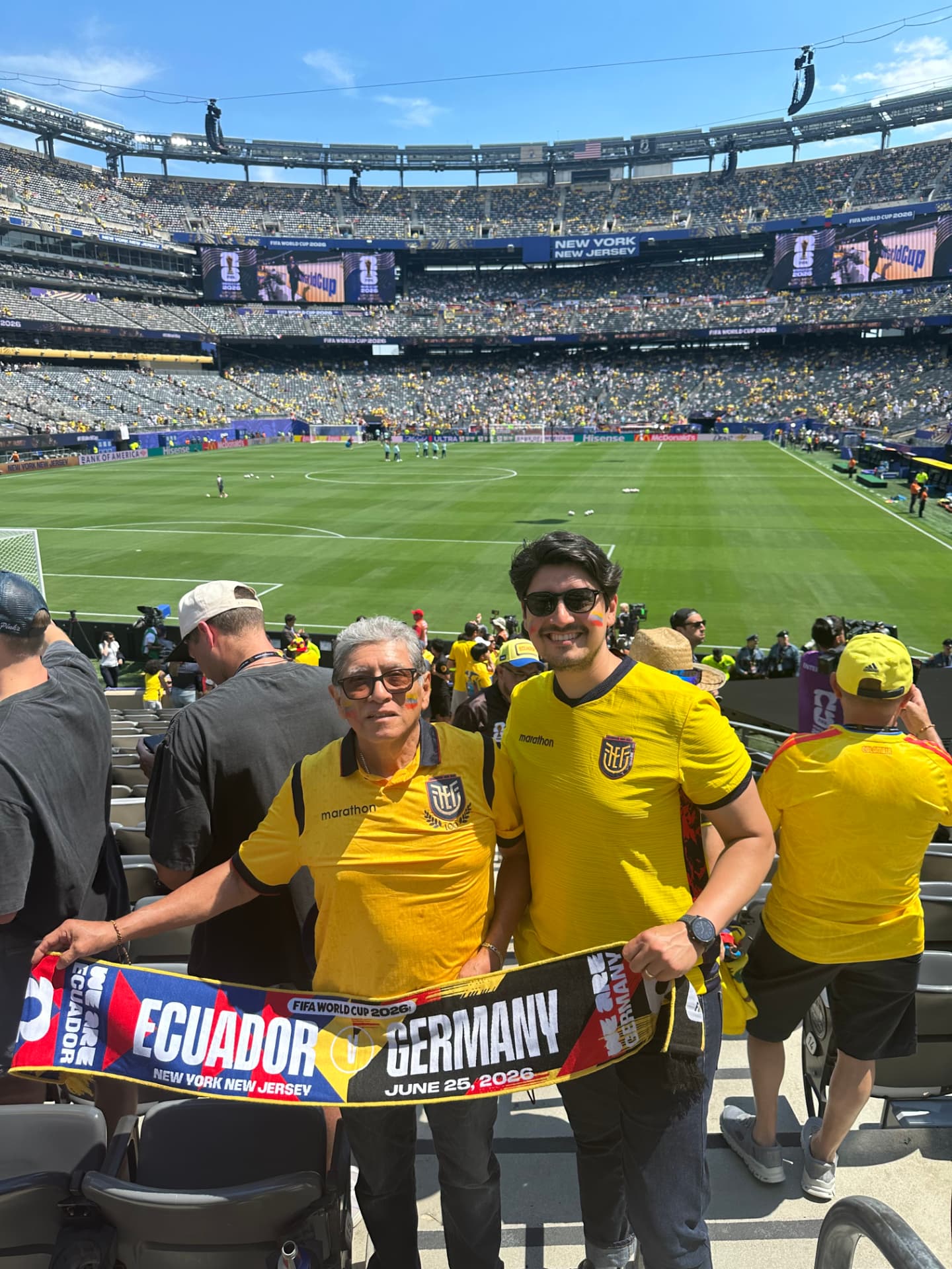 At the 2026 World Cup at MetLife Stadium holding an Ecuador vs Germany scarf